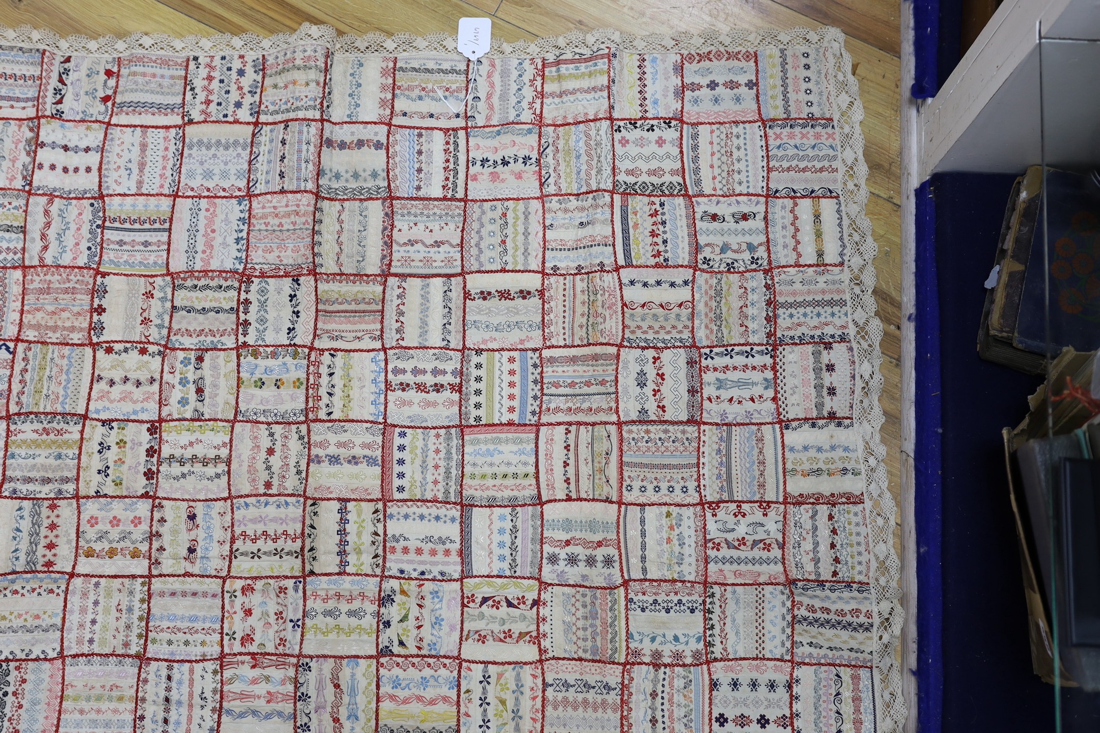 A French early 20th century ribbon patchwork cover with lace trimmimg